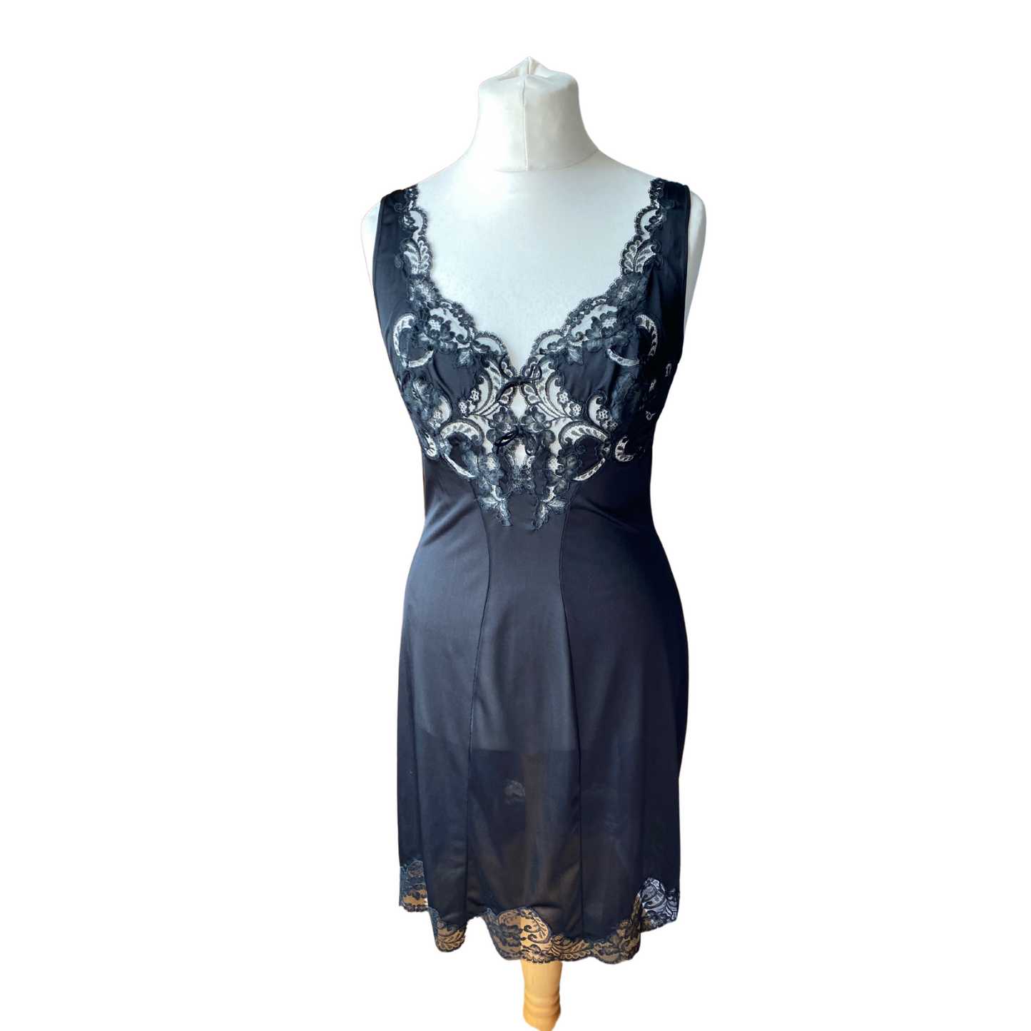 Black vintage full slip with lace bodice and lace trimmed hem. Wide straps and a v neck