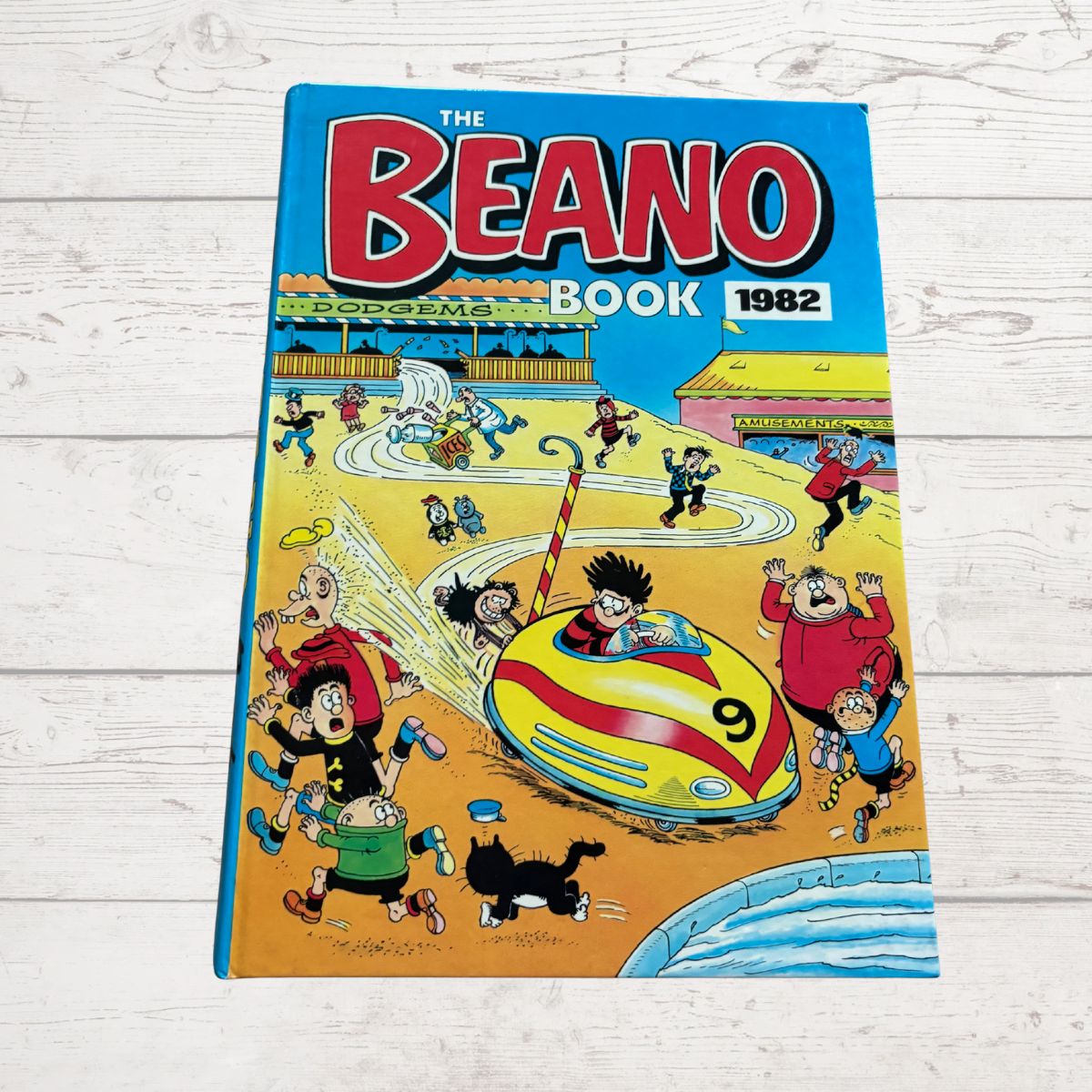 1982 Beano Book cover with cartoon characters on a wooden surface