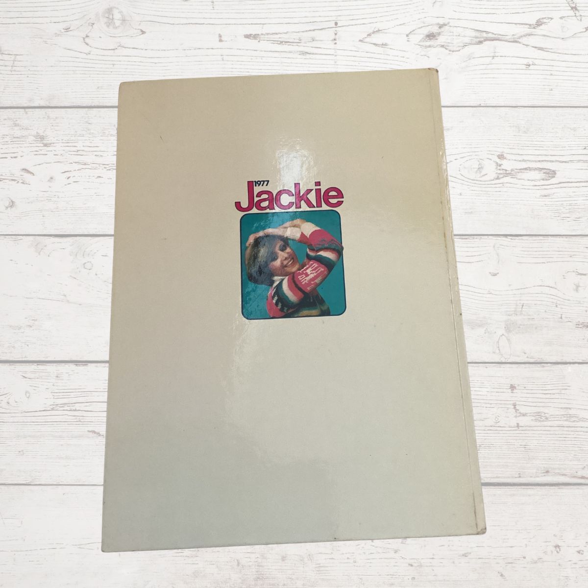 Book titled Jackie 1977 ' with a cover photo of a person on a beige background