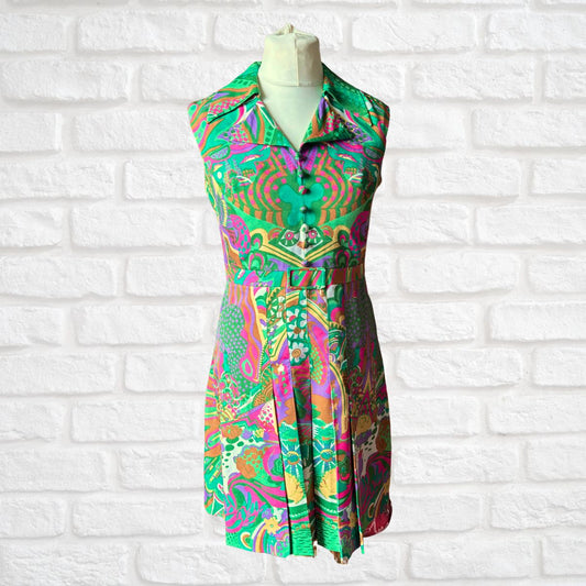 Colorful patterned dress on a mannequin against a white brick wall background