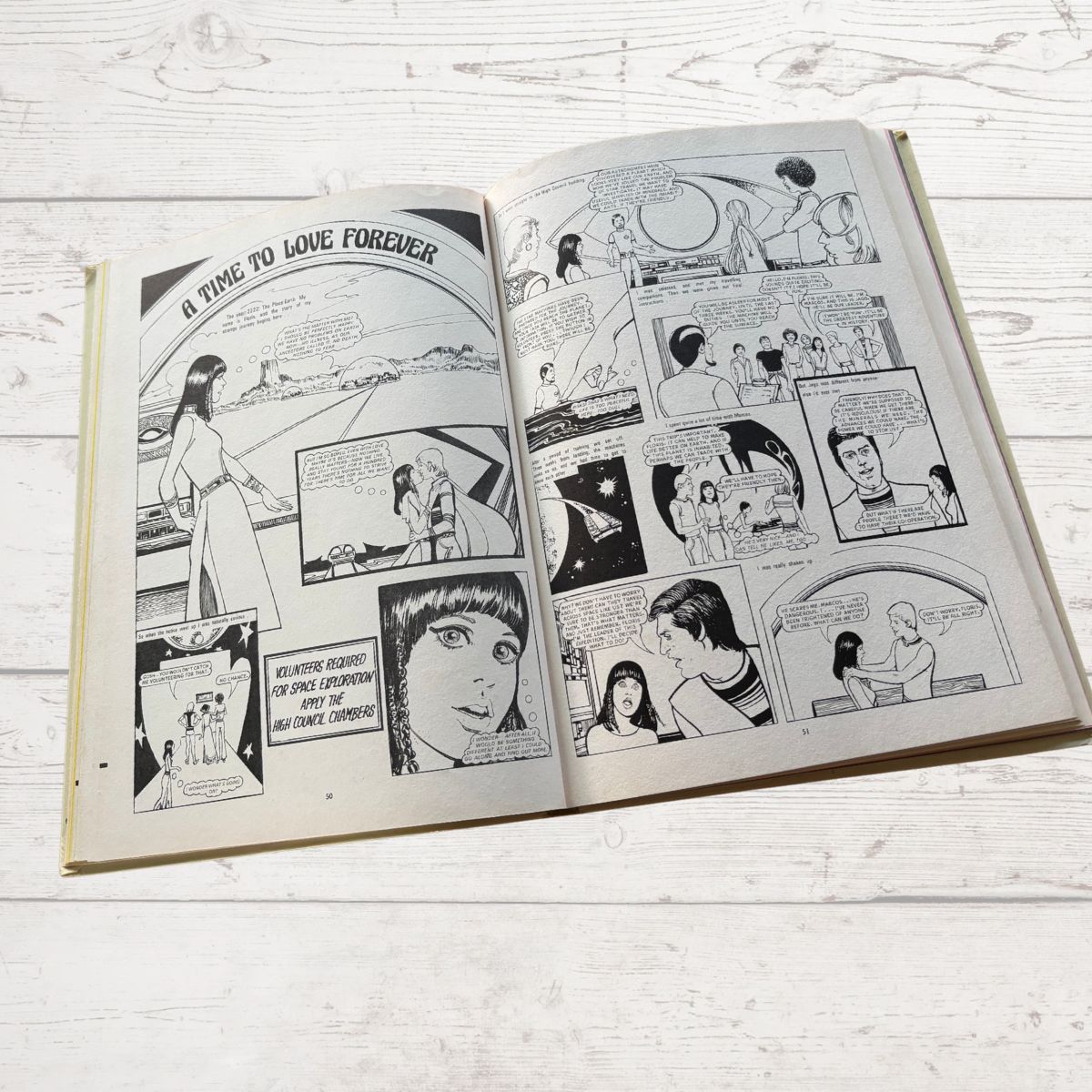 Open comic book on a wooden surface