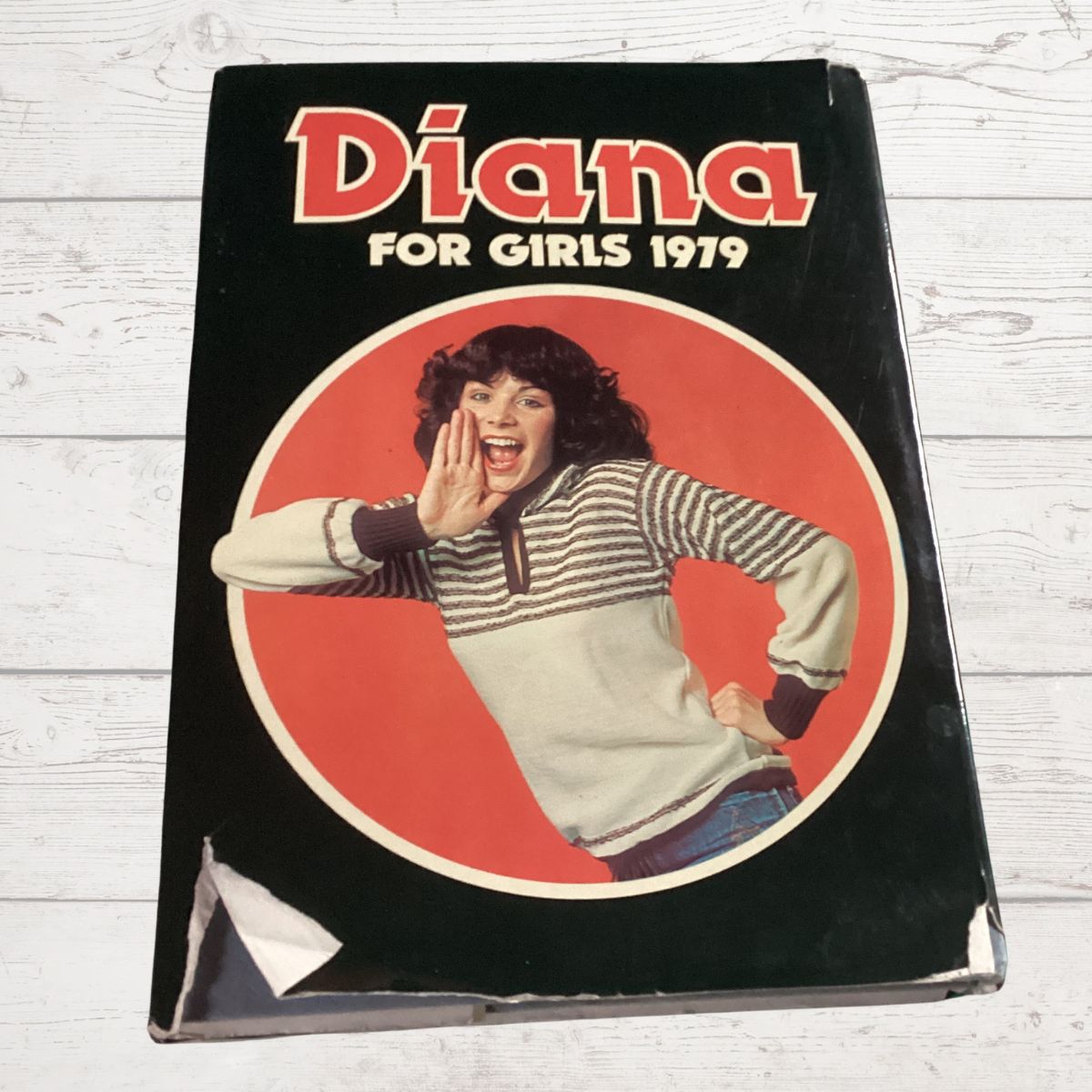 'Diana' for girls from 1979 on a wooden surface.