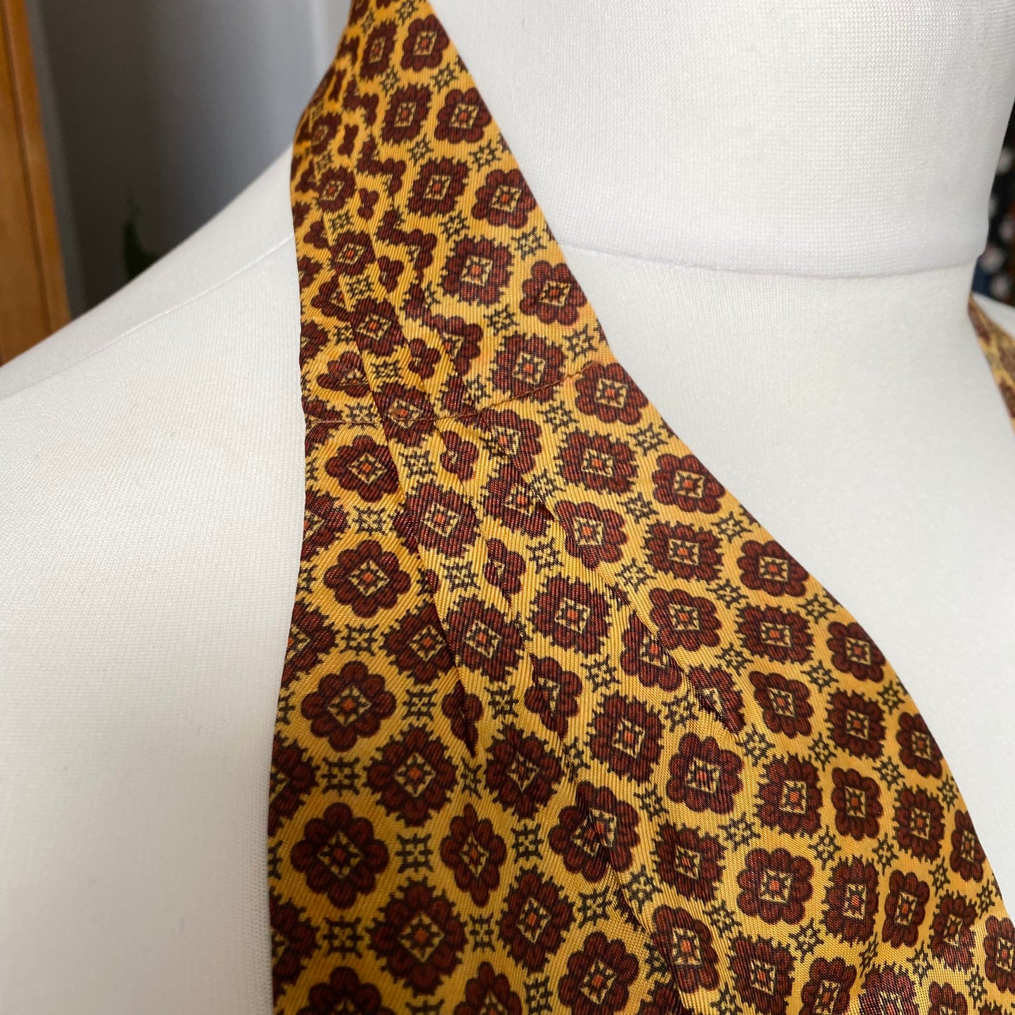 Mod style yellow, red and black abstract floral print vintage cravat by British brand Duggie