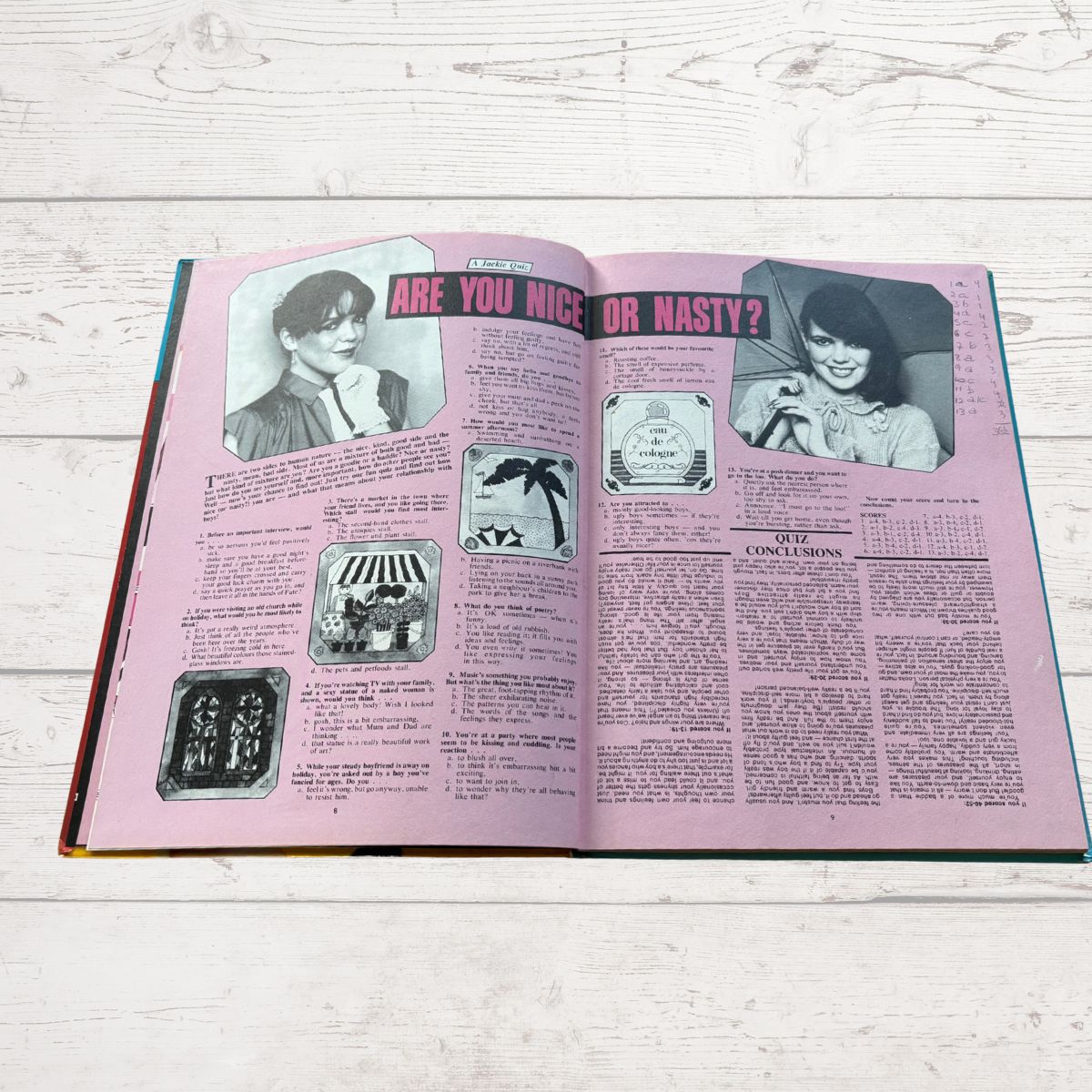 Open book with pink interior pages on a wooden surface