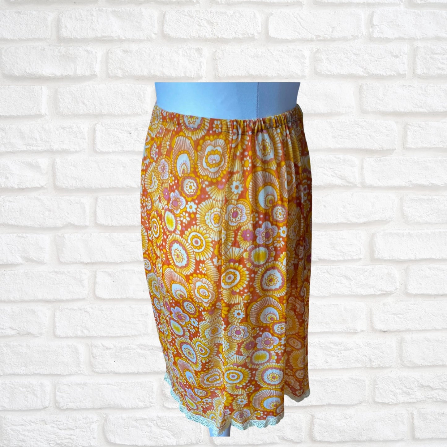 70s yellow and orange psychedelic print waist slip/ skirt. Approx U.K. size 14-20