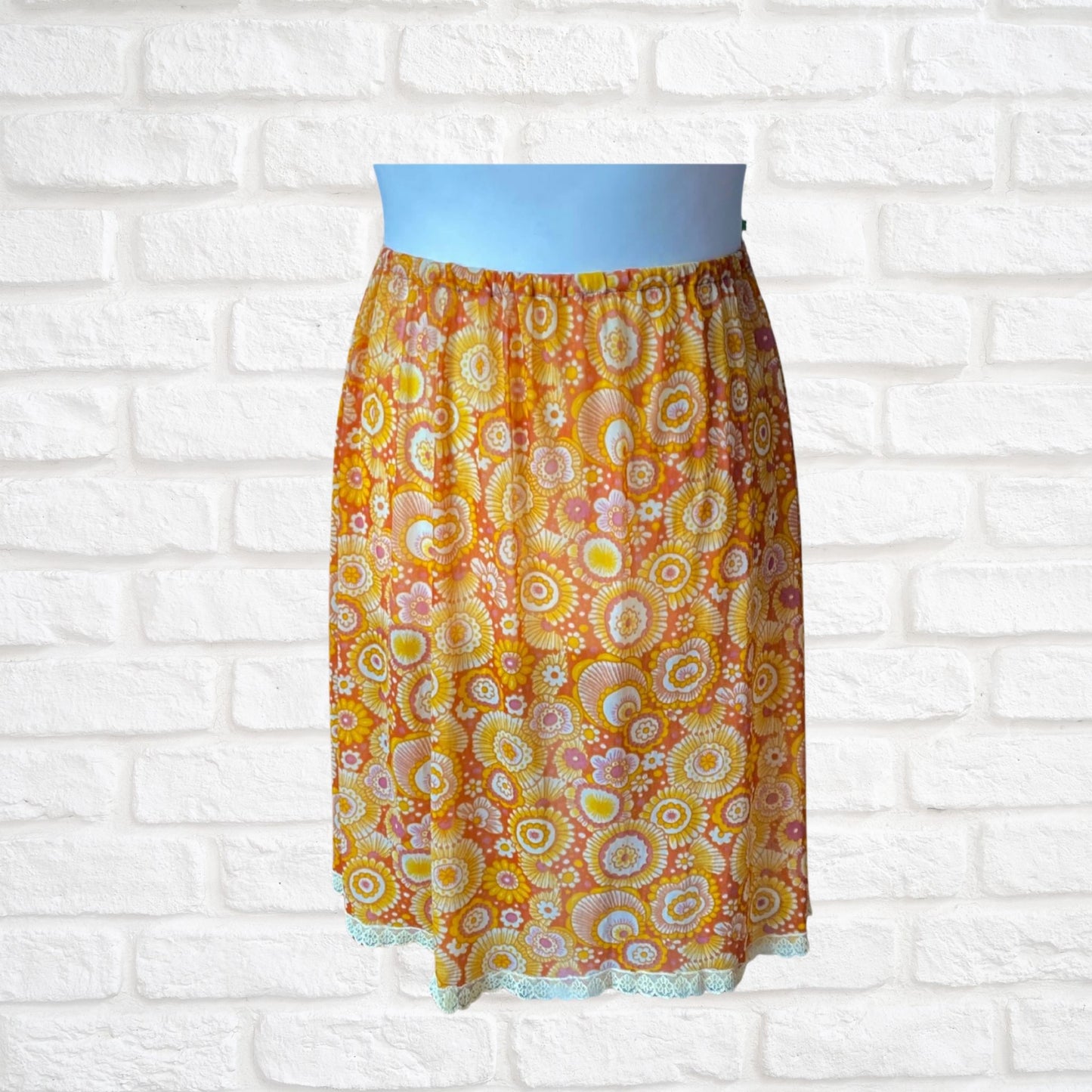 70s yellow and orange psychedelic print waist slip/ skirt. Approx U.K. size 14-20