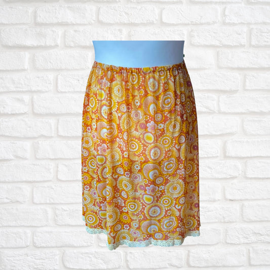 70s yellow and orange psychedelic print waist slip/ skirt. Approx U.K. size 14-20
