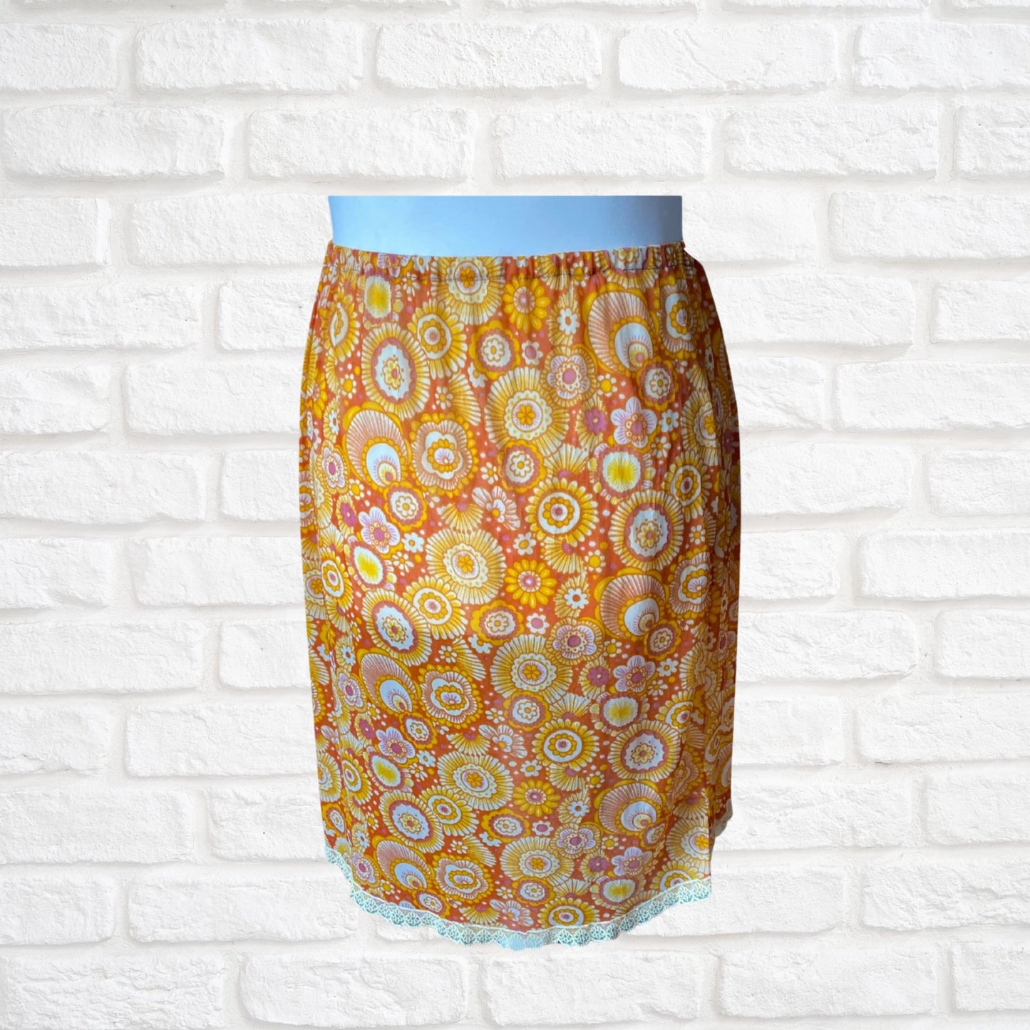 70s yellow and orange psychedelic print waist slip/ skirt. Approx U.K. size 14-20