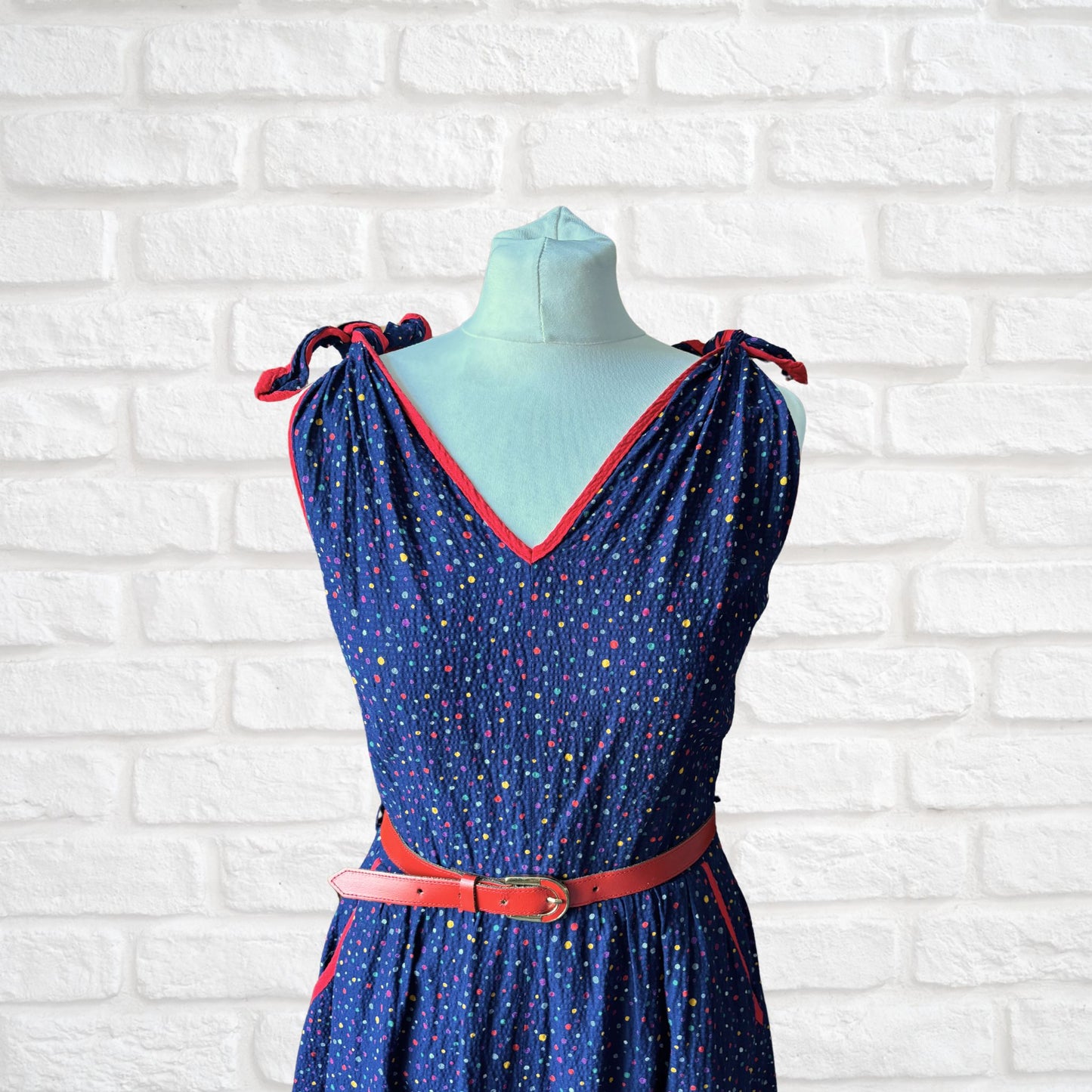 70s dark blue and rainbow polka dot sundress with red trim and belt. Approx UK size 10- 12