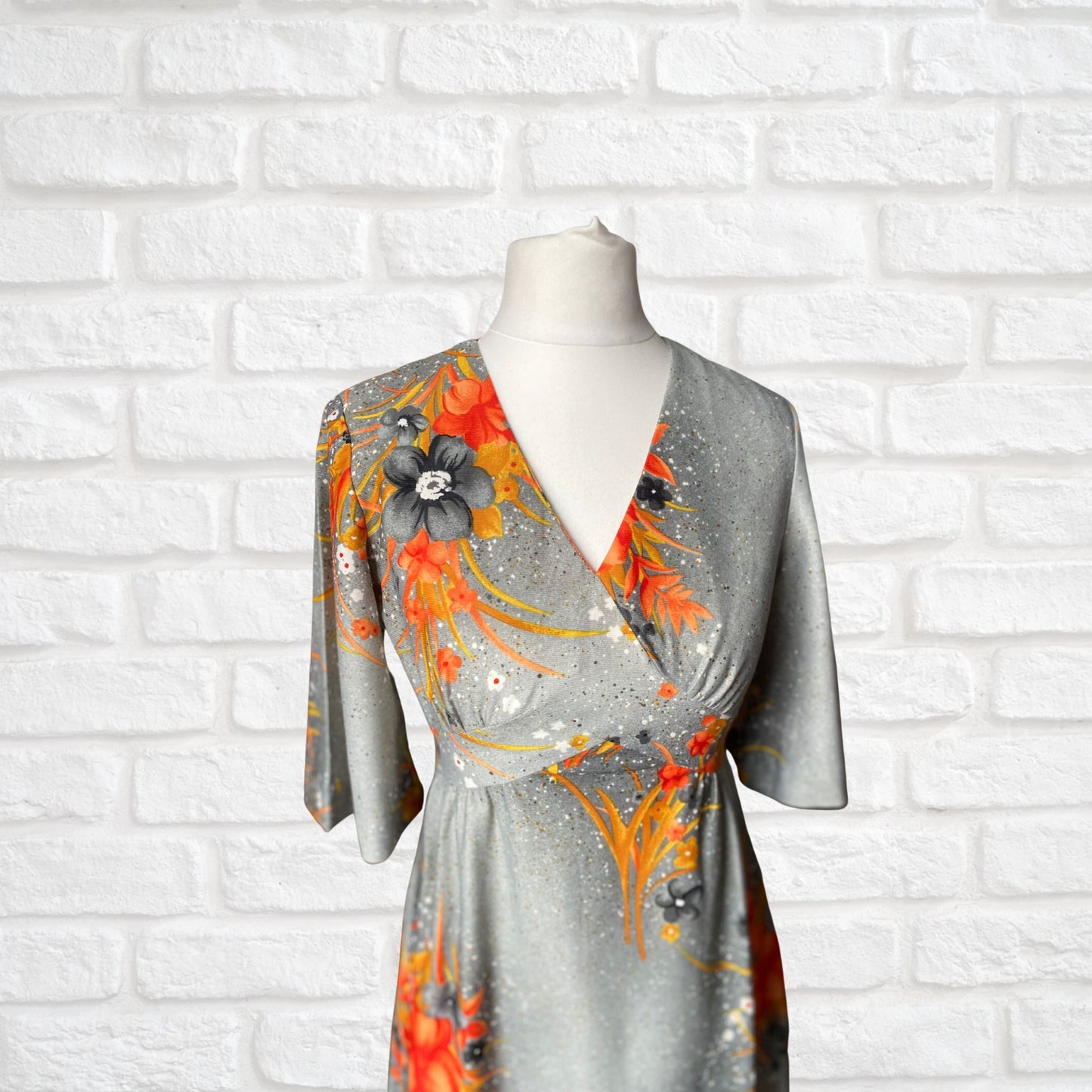 70s Hawaiian vintage maxi dress in an orange floral print.  Approx U.K. size 4-6