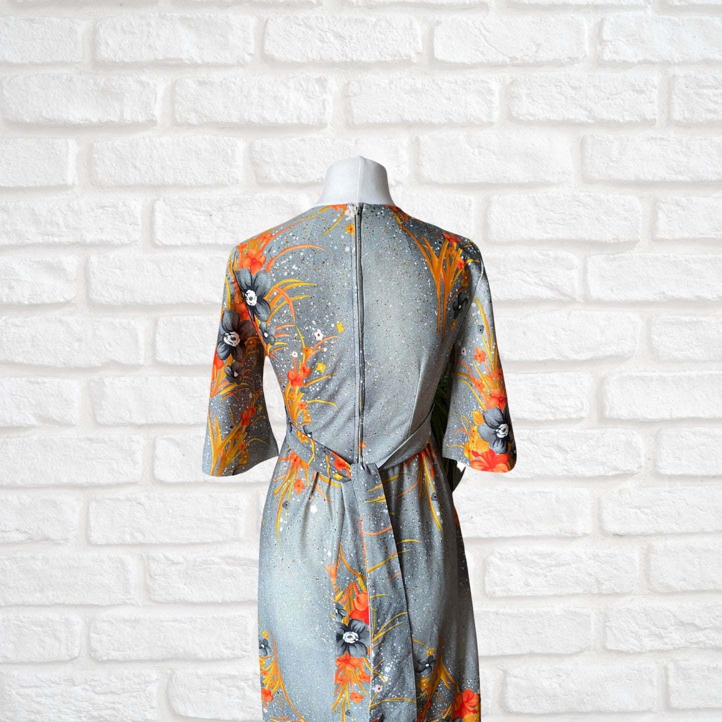 70s Hawaiian vintage maxi dress in an orange floral print.  Approx U.K. size 4-6