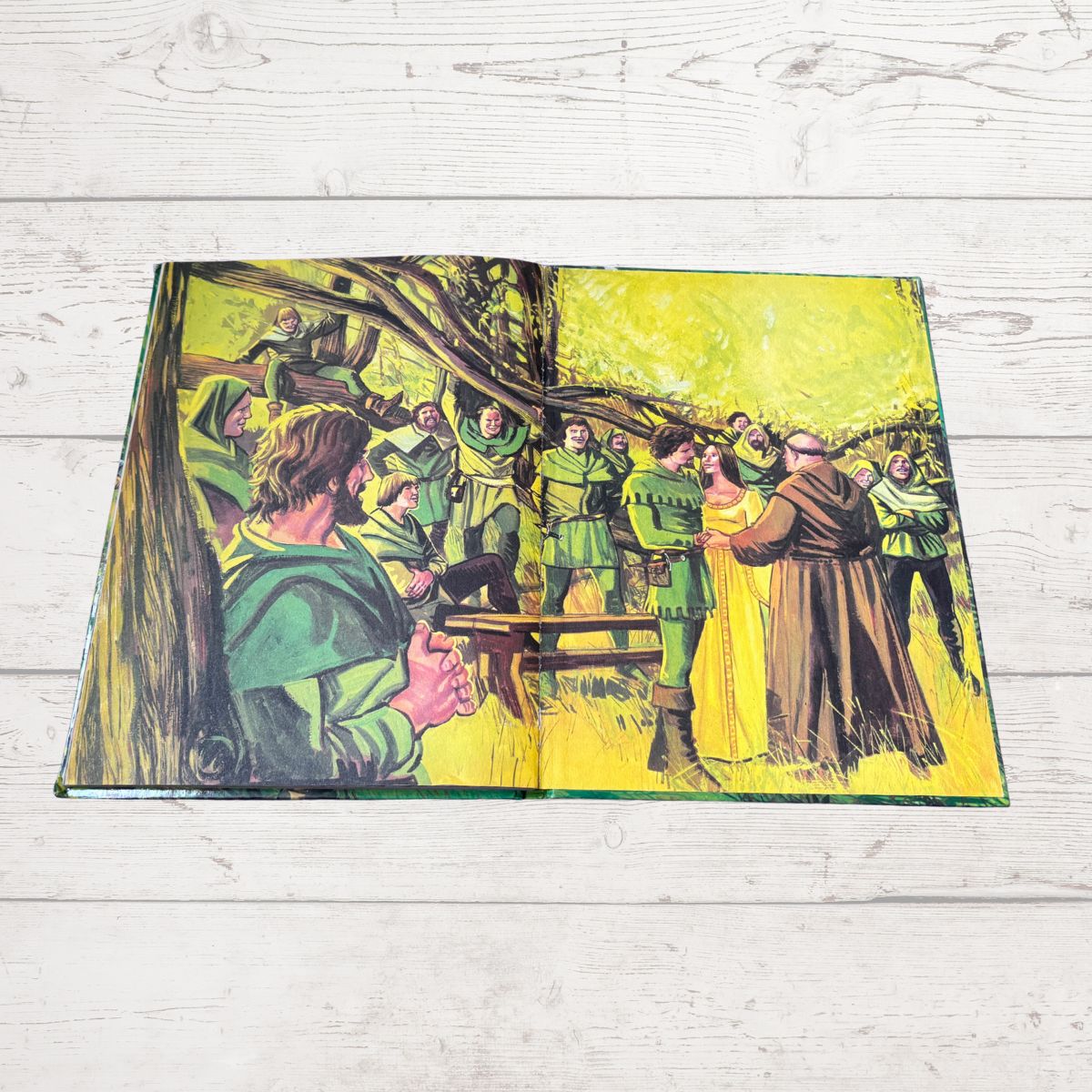 Open book with a colorful illustration of people in green and brown clothing on a yellow background.