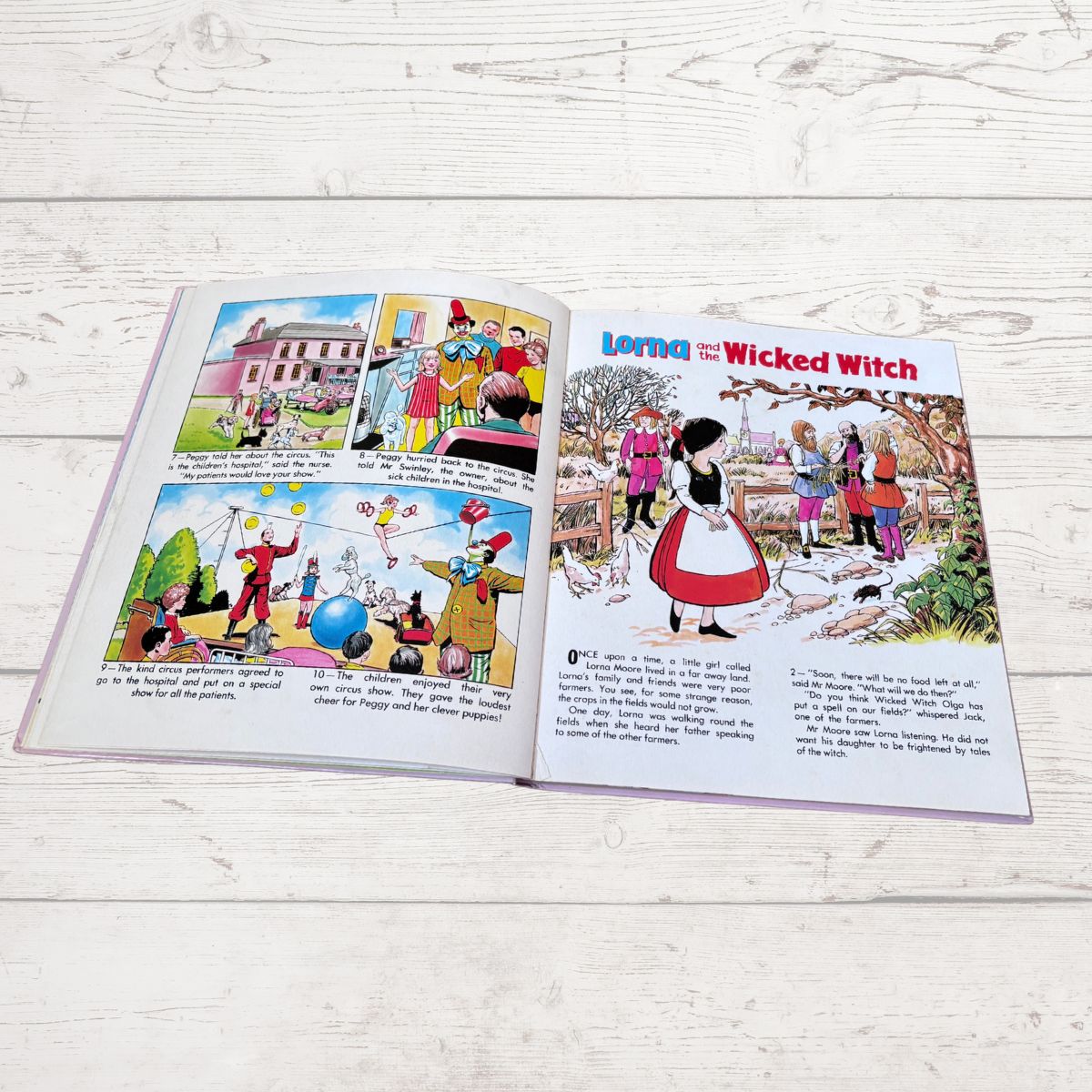 An open vintage children's book spread laid flat on a white wood surface. The left page contains four cartoon comic panels, and the right page has a large illustrated cover titled 'Lorna the Wicked Witch' with text below.