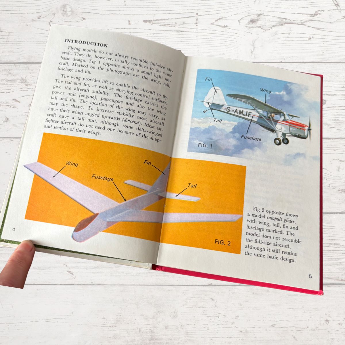 Open book with illustrations and text on model airplane design