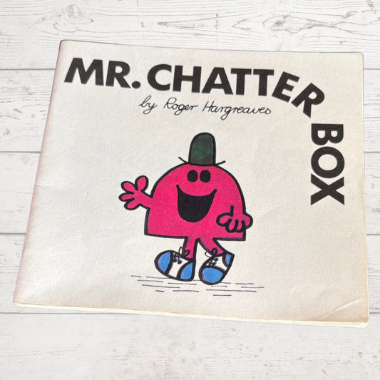 Mr. Chatterbox book cover with cartoon character on a wooden surface