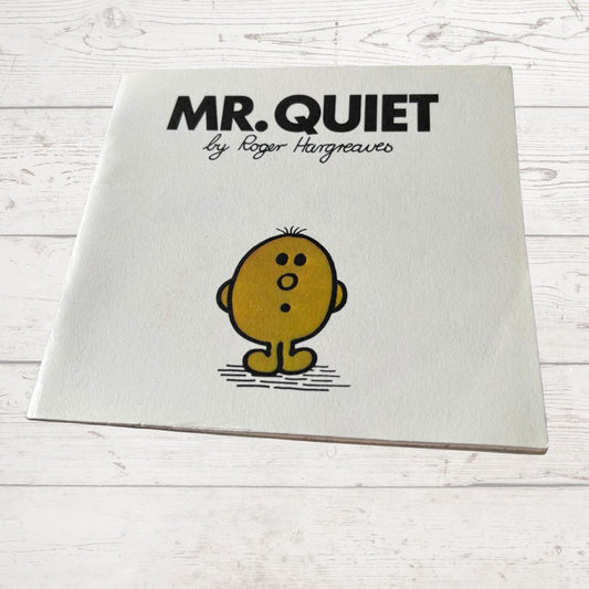 Book titled 'Mr. Quiet' by Roger Hargreaves on a white wooden surface