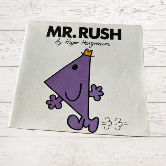 Book cover of 'Mr. Rush' by Roger Hargreaves on a white wooden surface
