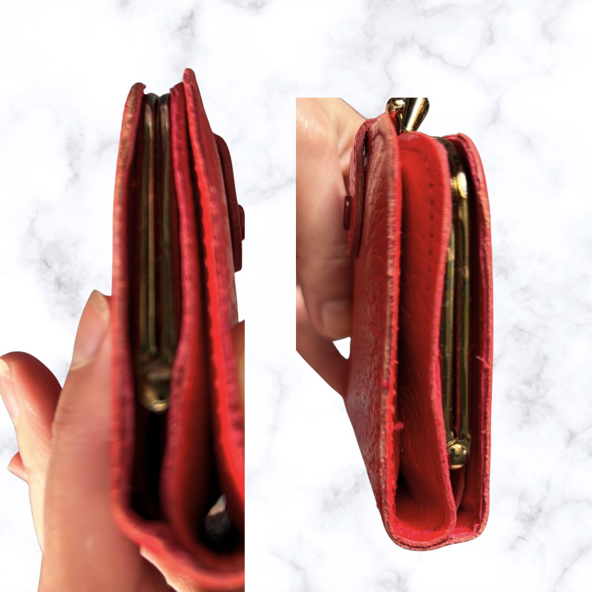Red wallet held open by a hand on a white marble background