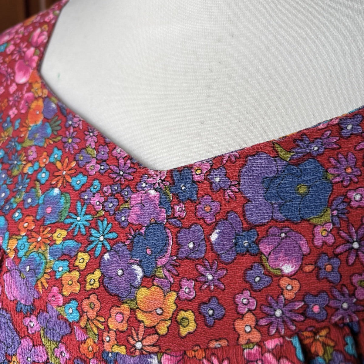 Colorful floral patterned fabric on a mannequin