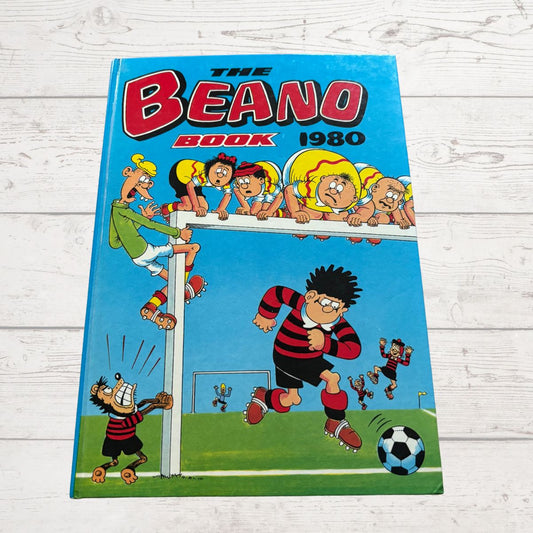 Vintage 'The Beano Book' from 1980 on a wooden surface