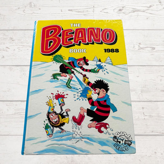 1988 'The Beano' book cover with cartoon characters on a wooden surface