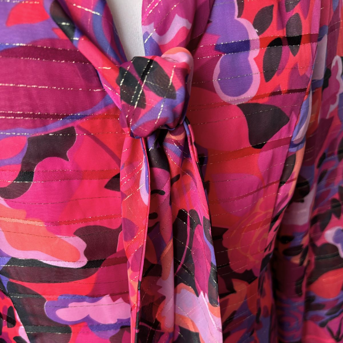 Close-up of a colorful patterned fabric with a knot.