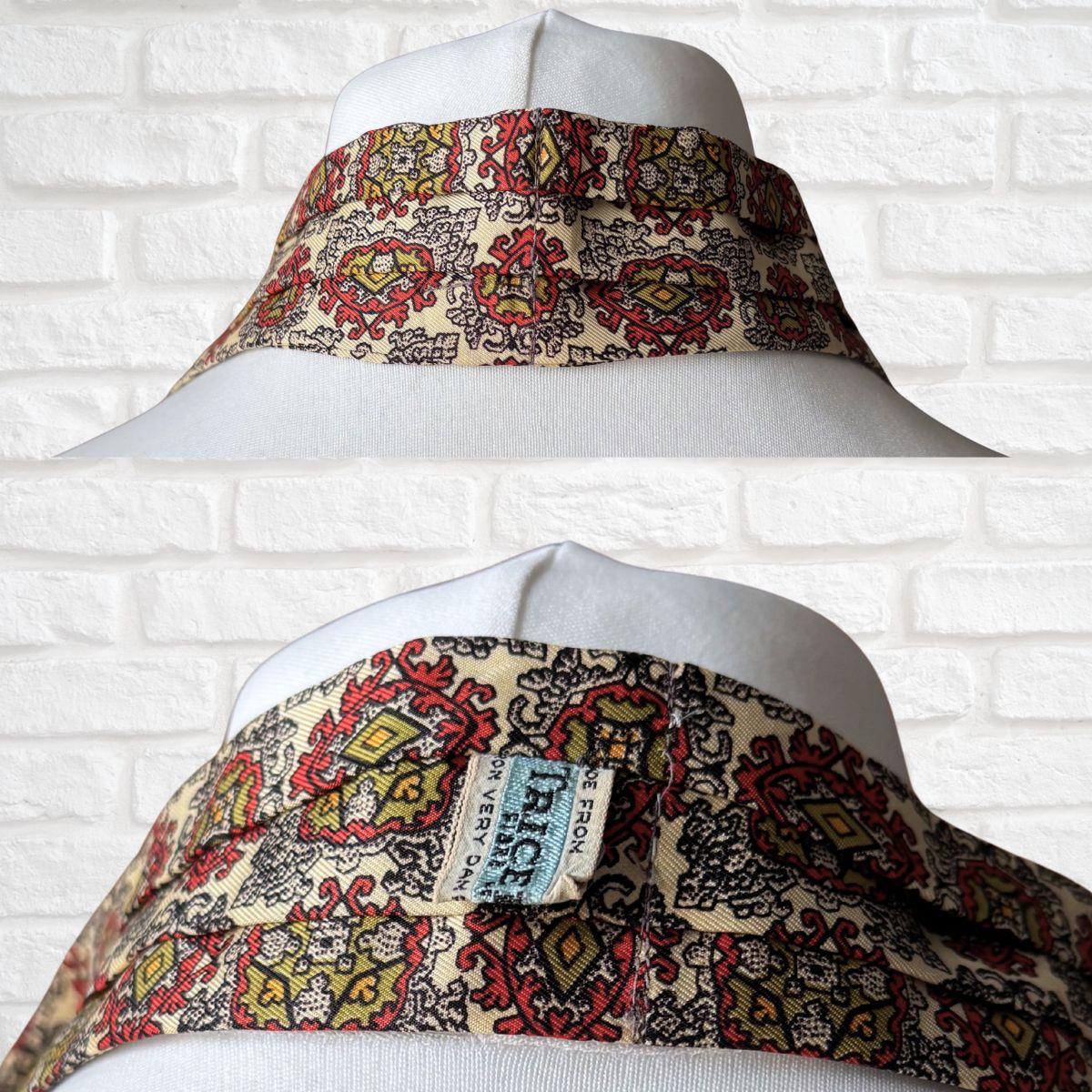 Patterned fabric on a mannequin against a white brick wall