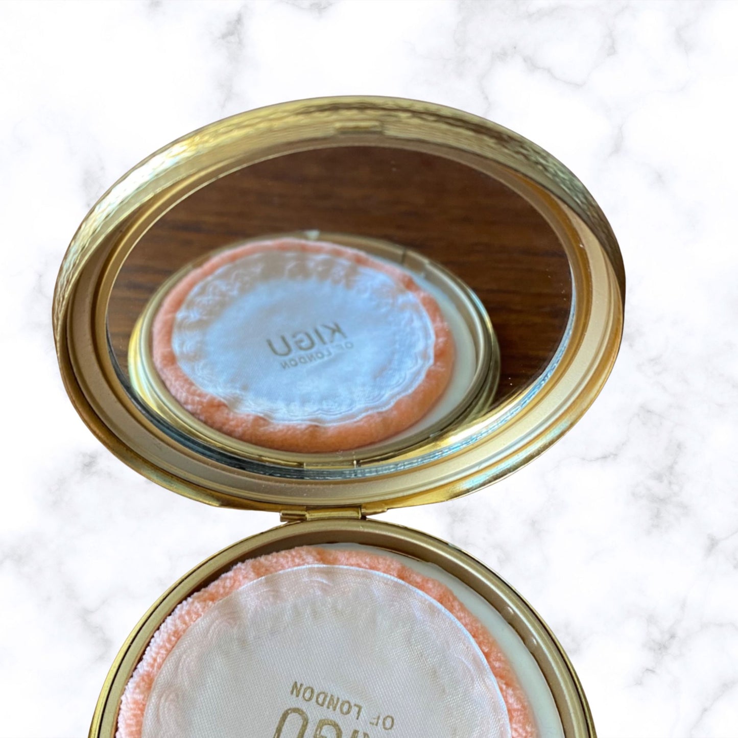 60s gold tone boxed and unused KIGU powder compact