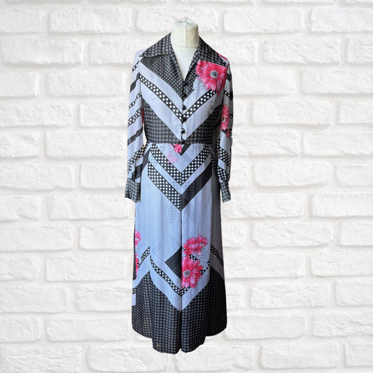 70s vintage long-sleeved maxi dress with grey and black stripes, polka dots, and floral design front full length view