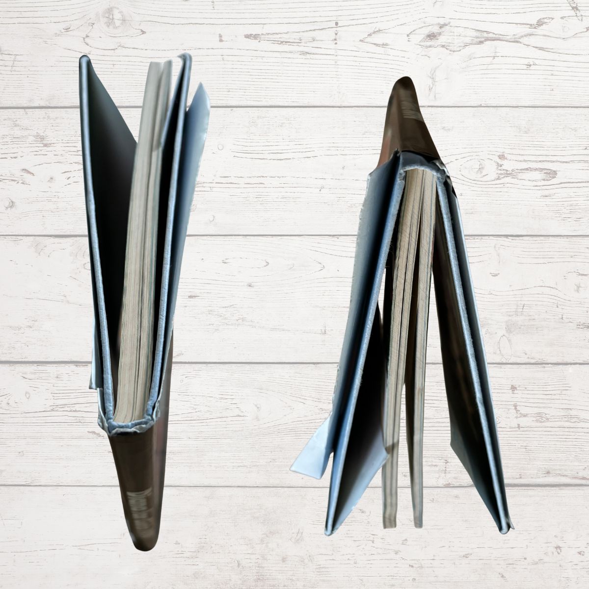 Book edges on a light wooden surface