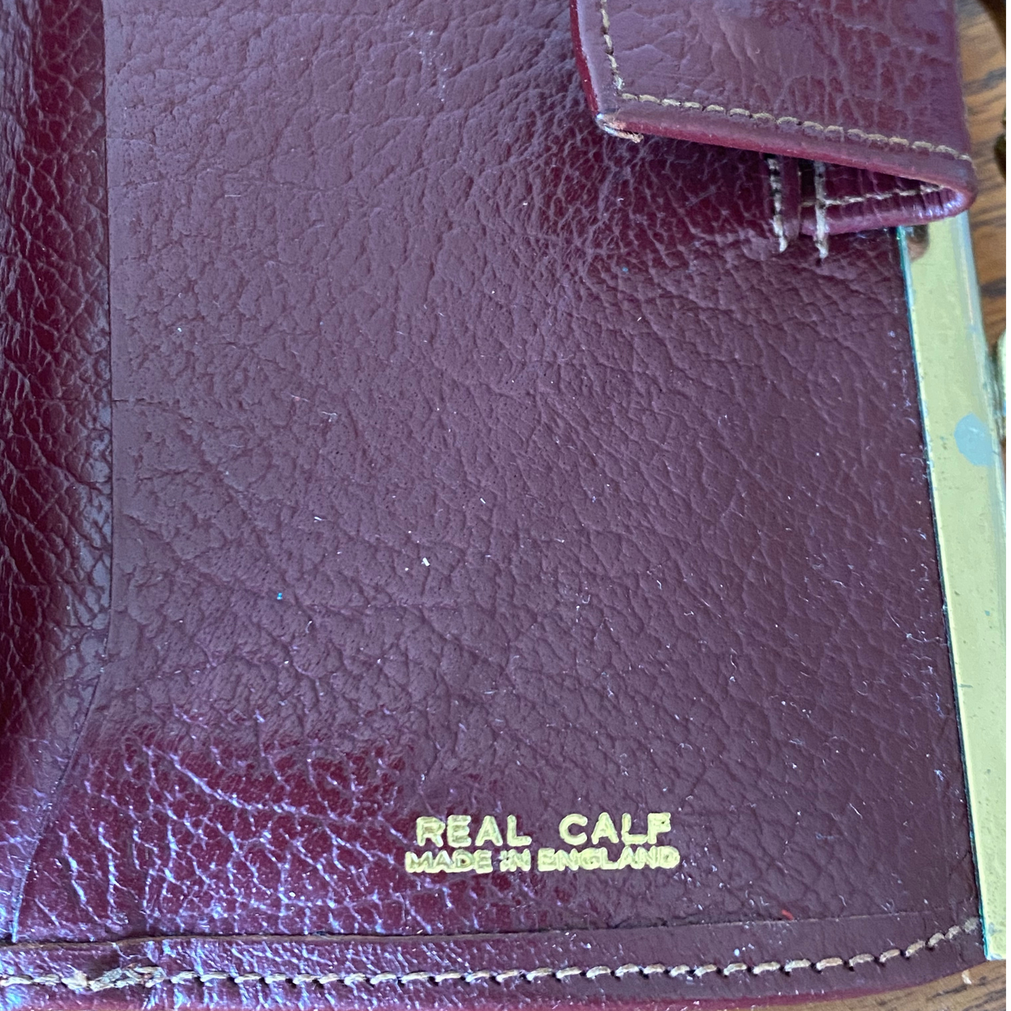 Classic red brown leather purse/wallet with a secure clasp and spacious interior
