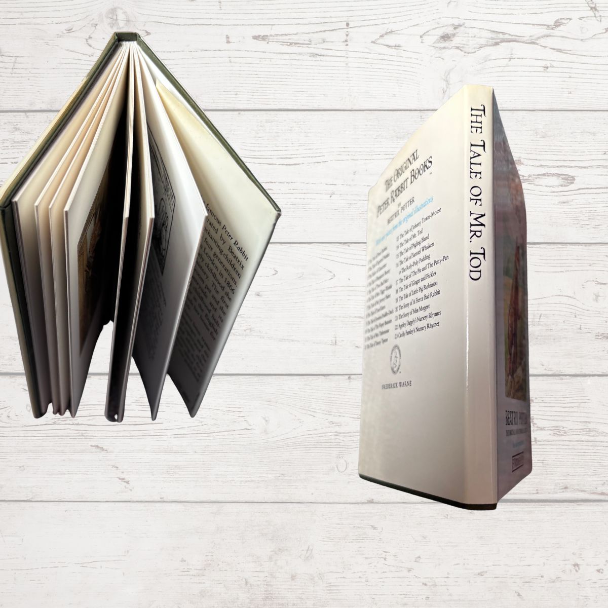 Open book with visible text and pages on a white wooden surface