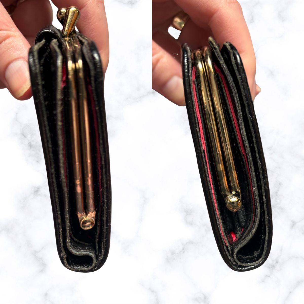 Black leather wallet with gold accents held open by a hand on a white background