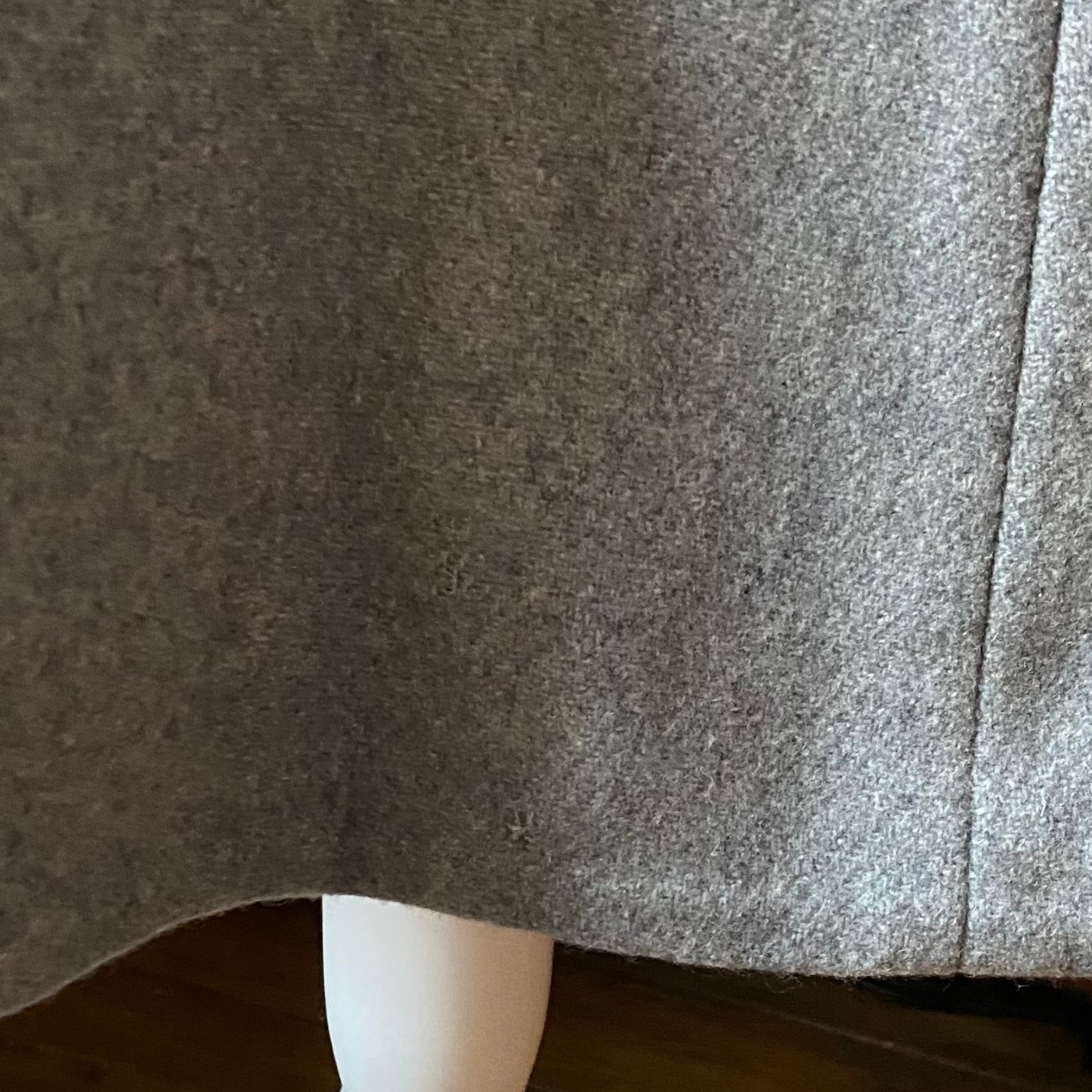 Close up of small mend at the back hem