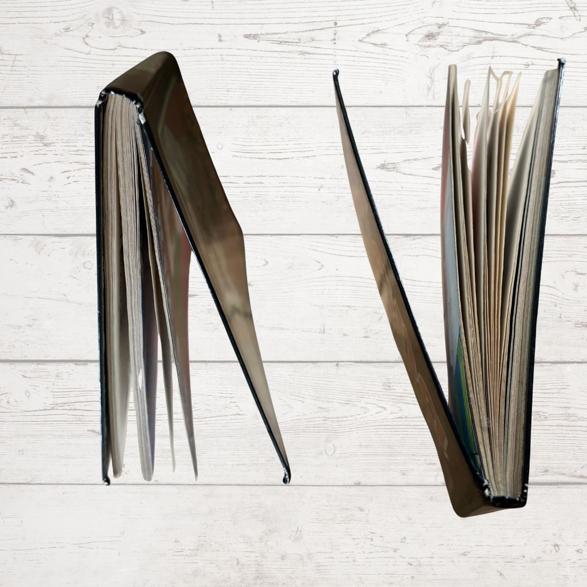 book edges on a light wooden surface