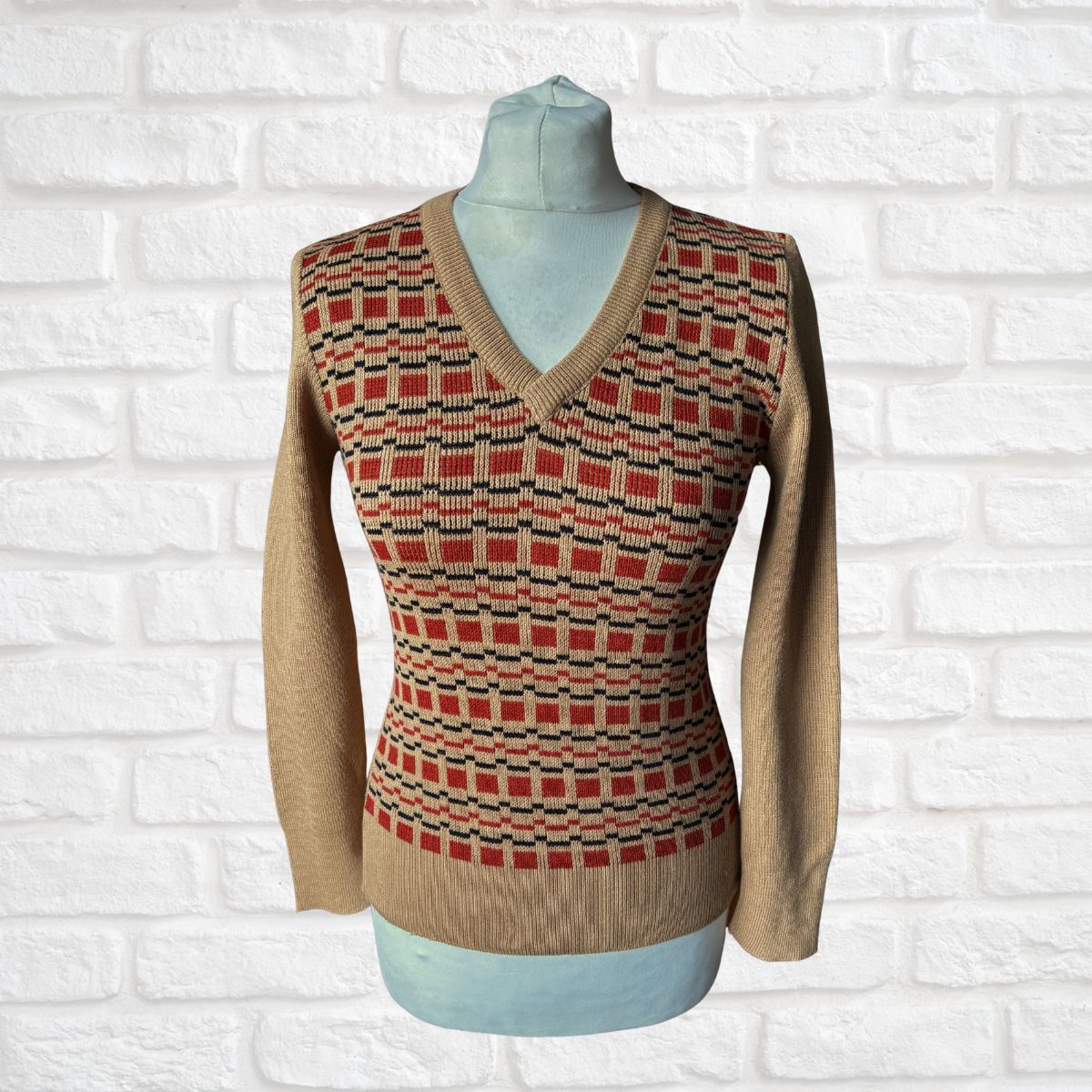 V neck camel 70s pullover with red squares and black lines on a white background