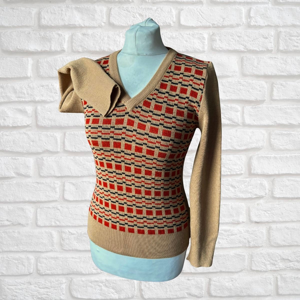 V neck patterned 70s jumper on a white background