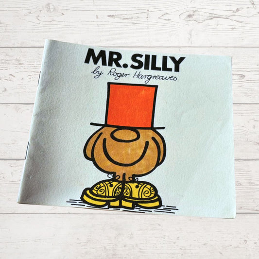 Book titled 'Mr. Silly' by Roger Hargreaves on a light wooden surface