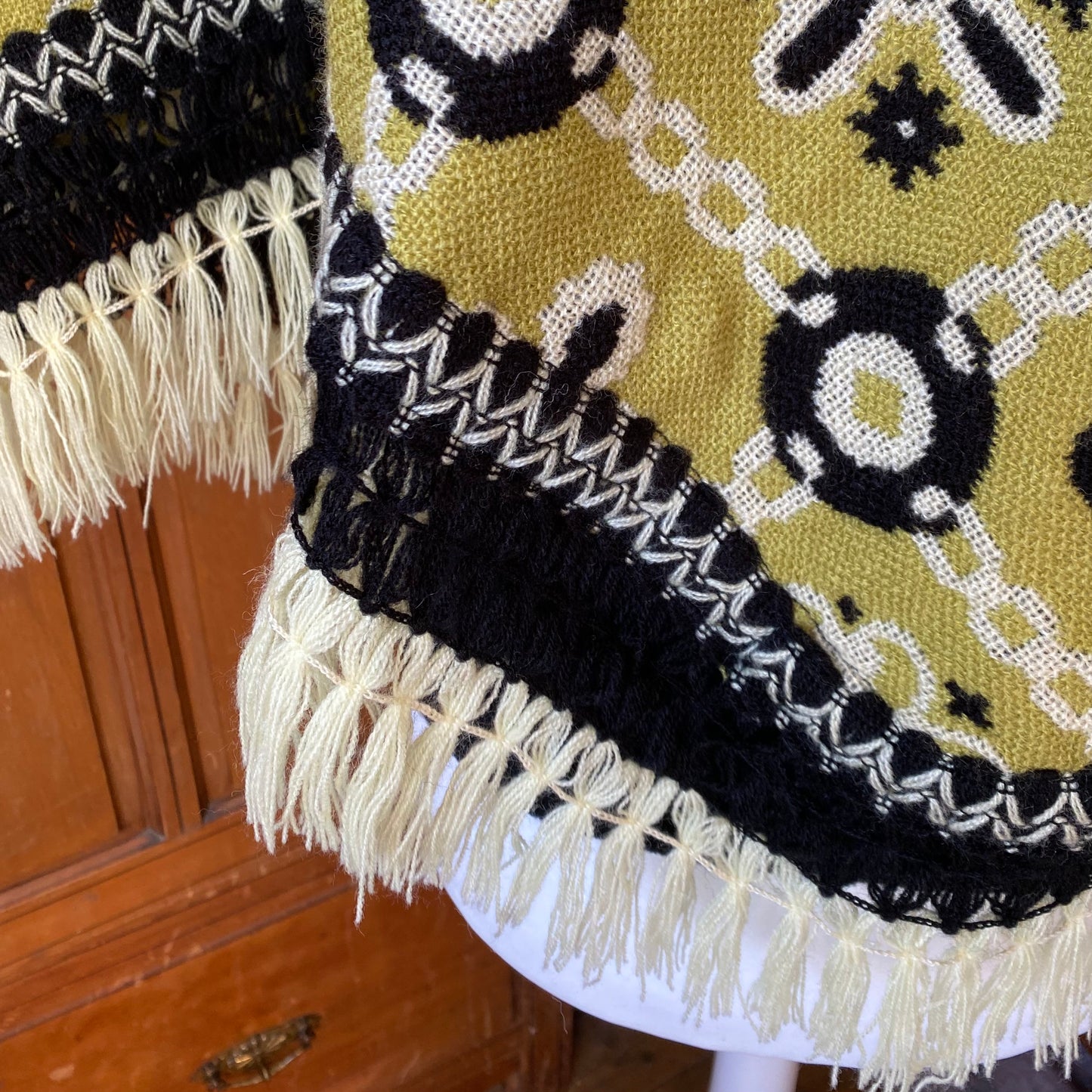 70s green and black reversible fringed poncho/cape. Approx U.K. size 10 -16