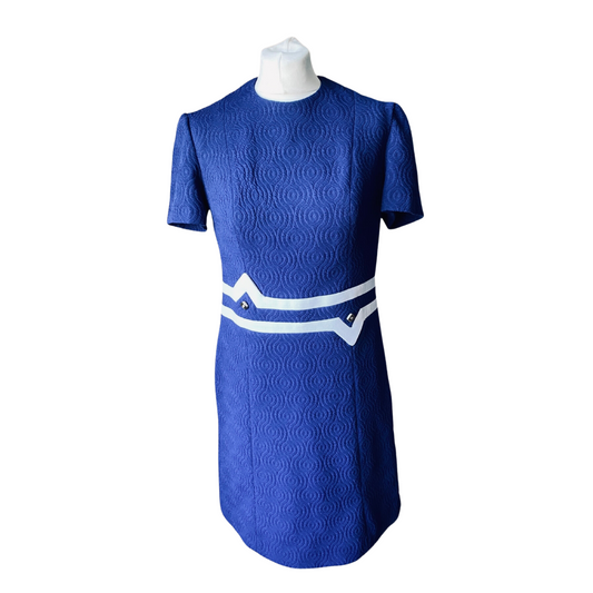 Dark blue 60s scooter dress with white striped trim and button detailing at the waist.