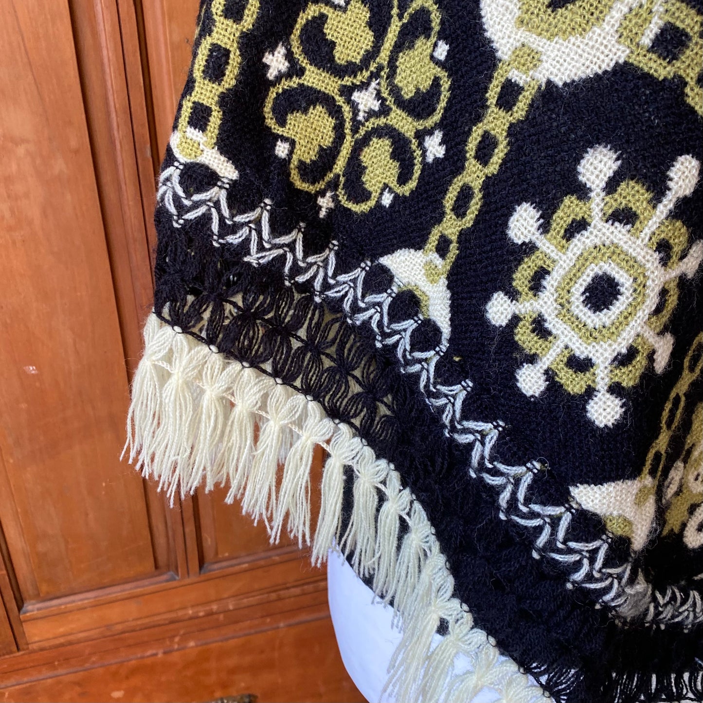 70s green and black reversible fringed poncho/cape. Approx U.K. size 10 -16