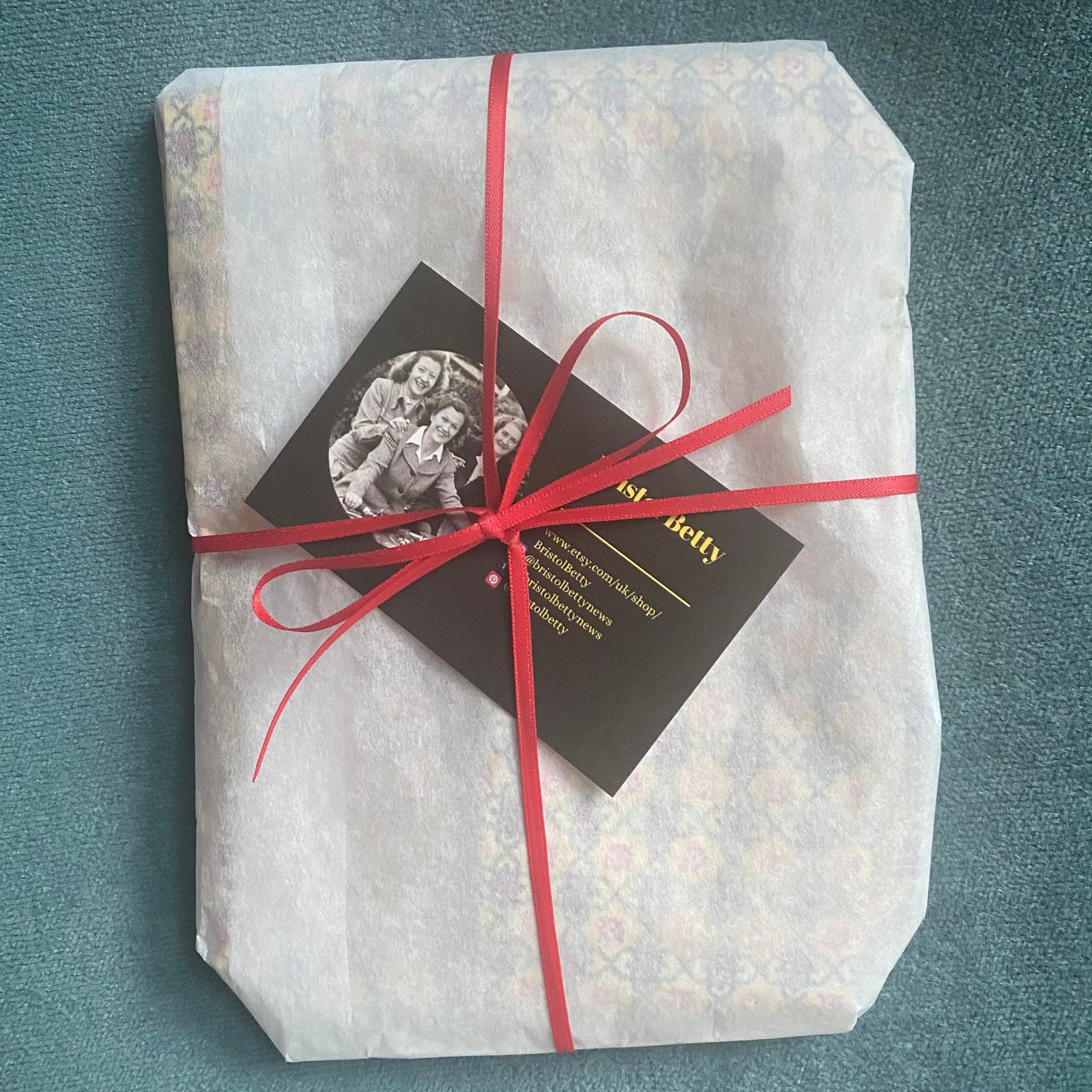 Long vintage black and gold paisley print  scarf with hand rolled edges. Great gift idea