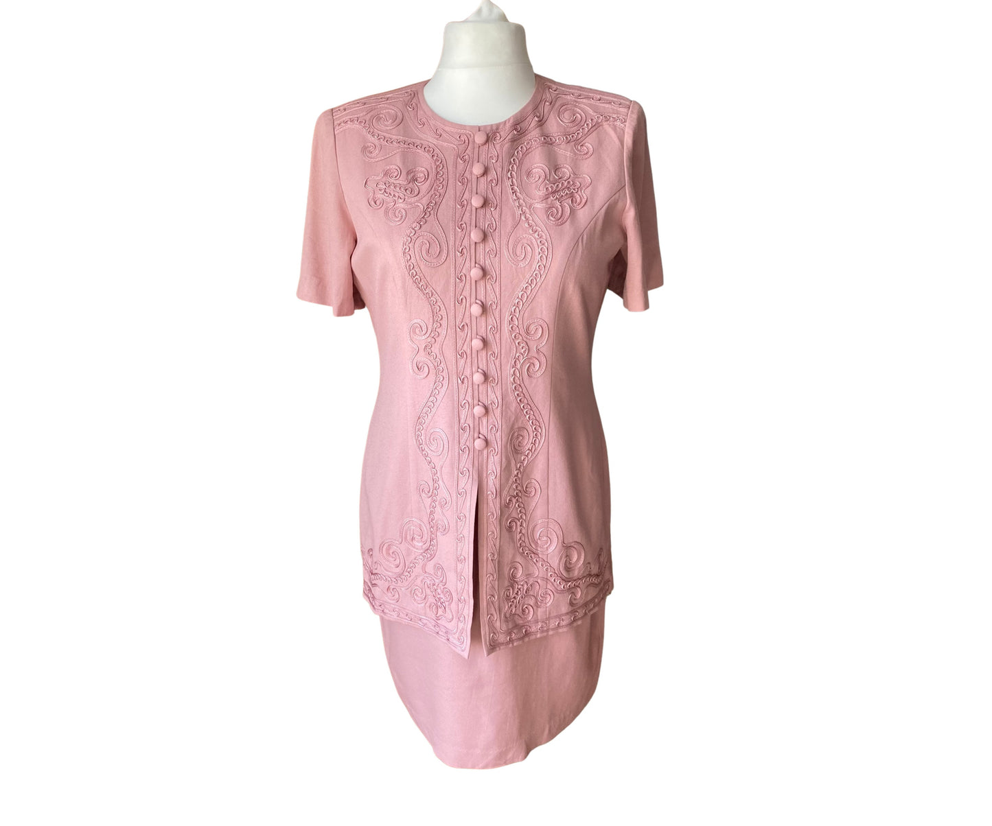 Vintage 80s pink suit dress with fabric covered buttons, short sleeves and soutache detailing.