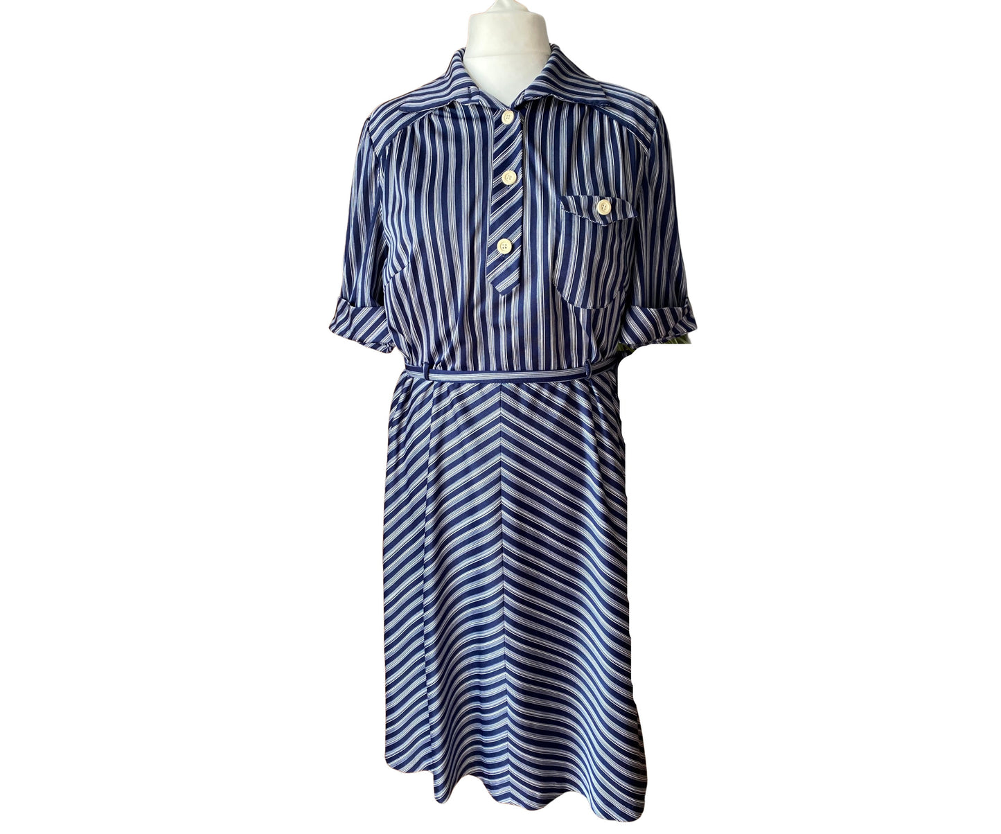 A navy blue and white vintage shirt waisted dress with large white buttons and a belt
