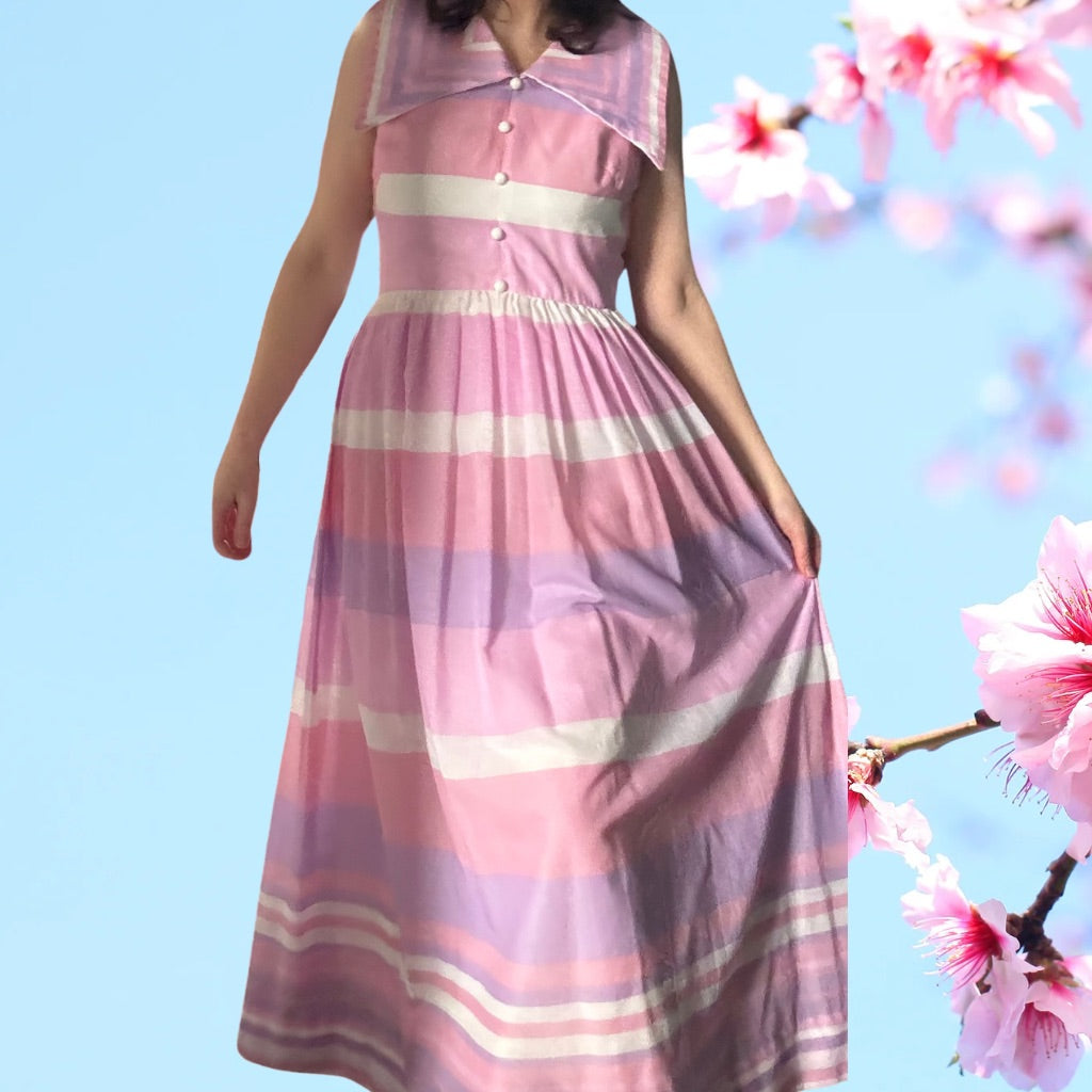 A red and white gingham 70s maxi dress with pearly buttons, a high lace trimmed neck and white lace of the bodice