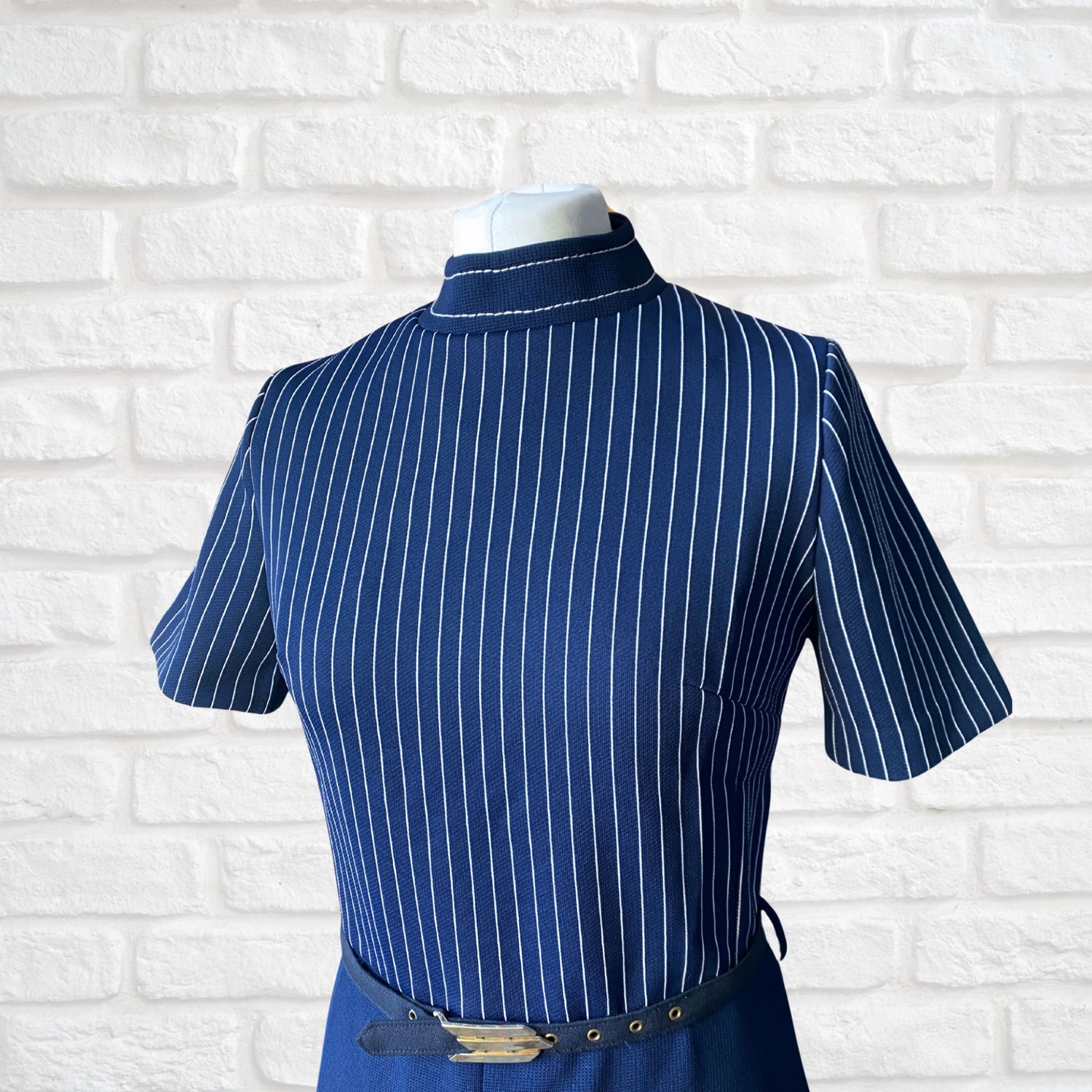 A navy blue and white striped belted 60s mod dress
