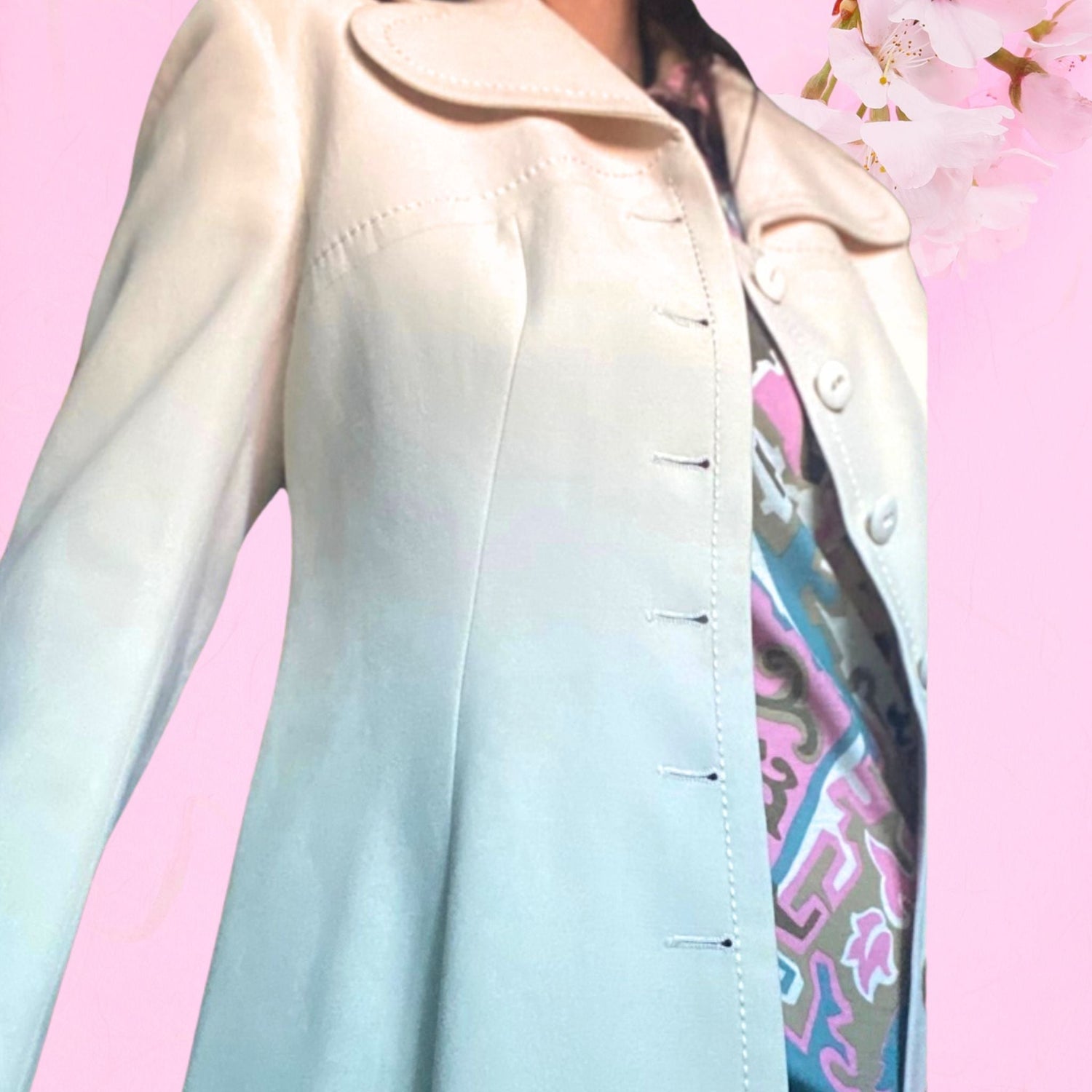 A white 3/4 length mod coat with large rounded collars worn over a dark blue and white striped scooter dress