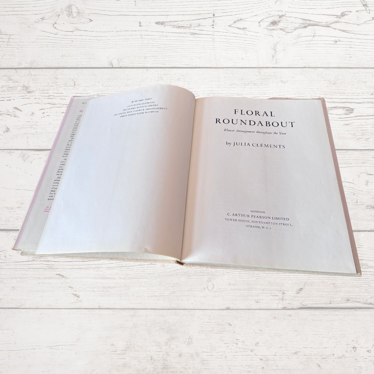 Open book titled 'Floral Roundabout' on a wooden surface
