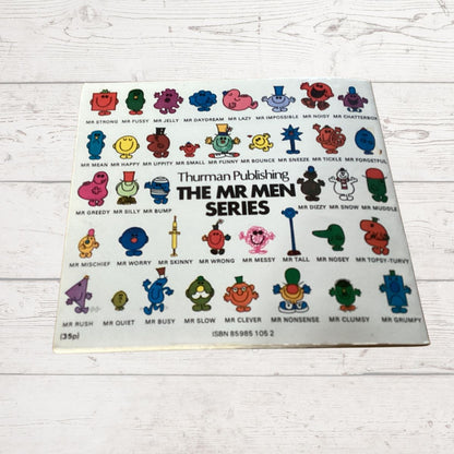 Book cover of 'The Mr Men Series' by Thruman Publishing on a wooden surface