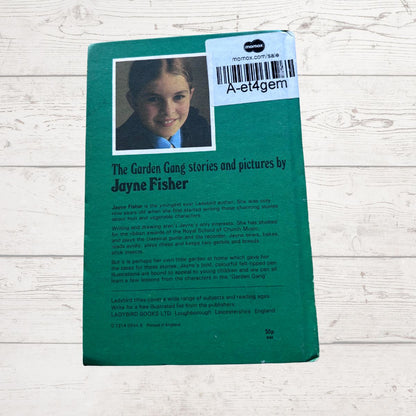 Book cover with a child's photo and text on a wooden surface